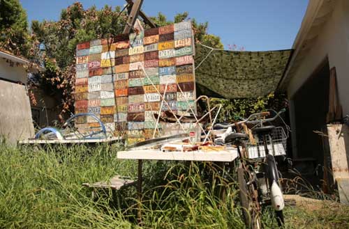 A license plate assemblage in the couple’s drought-resistant backyard workshop Photo by Hank Cherry